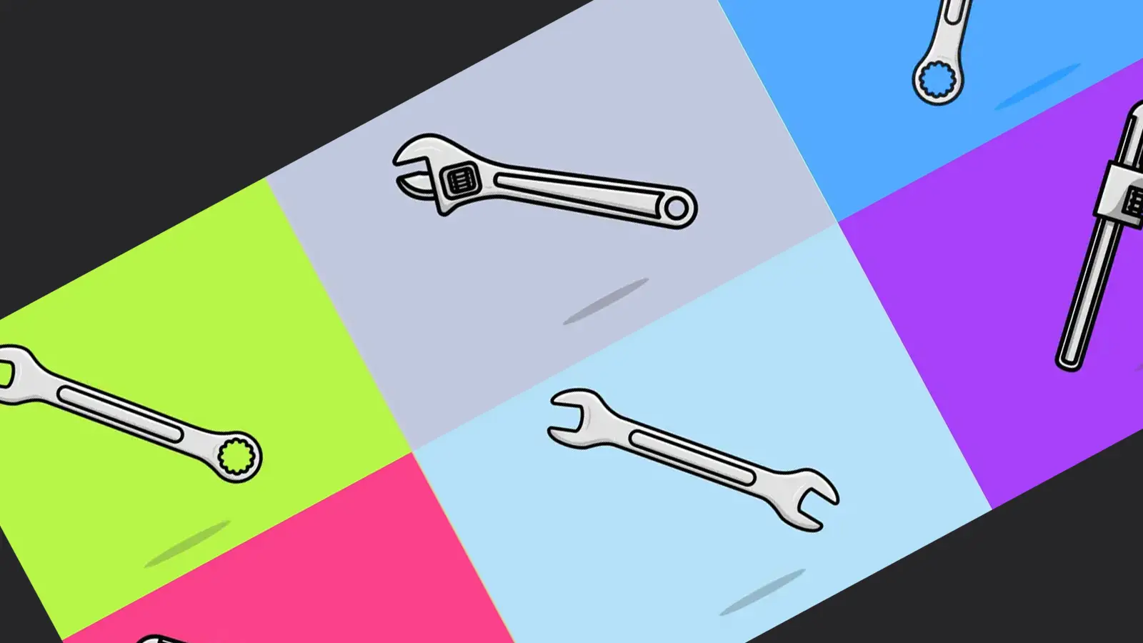 Different adjusting spanners on a colorful checkered background