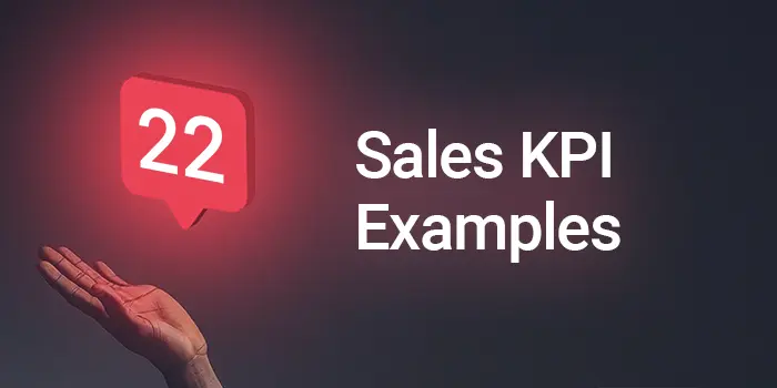 A red hand holding a sign that says 22 Sales KPI Examples